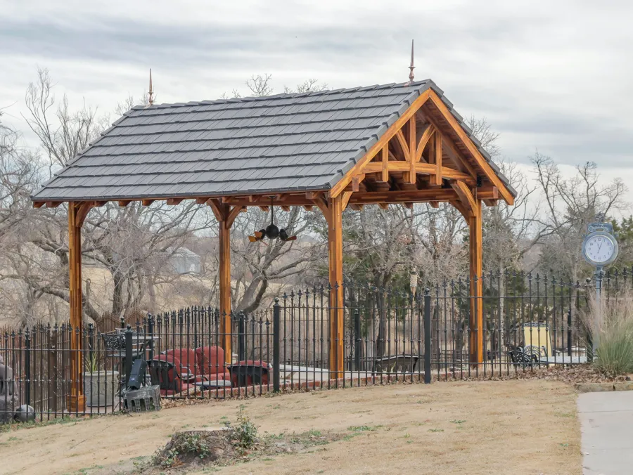 Custom Granada Pavilion (Options: 20 ft x 15 ft, Mosaic Redwood, 4-Post Anchor Kit for High-Wind, No Fascia Board, No Curtain Rods, 3 Ceiling Fan Bases, Transparent Premium Sealant). Shake from DaVinci Roof [https://www.davinciroofscapes.com/]. Photo Courtesy of K. Lowe of Newcastle, Oklahoma.