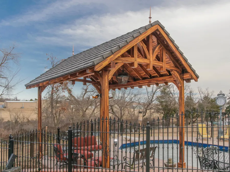Custom Granada Pavilion (Options: 20 ft x 15 ft, Mosaic Redwood, 4-Post Anchor Kit for High-Wind, No Fascia Board, No Curtain Rods, 3 Ceiling Fan Bases, Transparent Premium Sealant). Shake from DaVinci Roof [https://www.davinciroofscapes.com/]. Photo Courtesy of K. Lowe of Newcastle, Oklahoma.