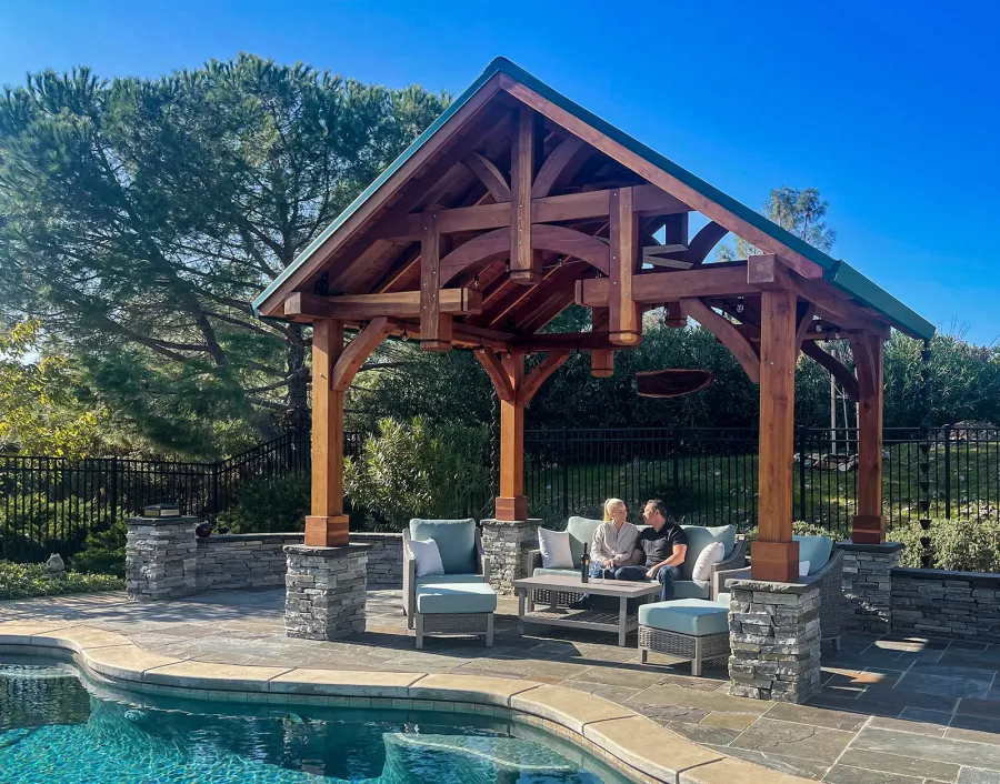 Custom Granada Pavilion (Options: 12’ L x 16’ W, California Redwood, 4-Post Anchor Kit for High Wind, Electrical Wiring Trim Kit for 1 Post, 1 Ceiling Fan Base, Transparent Premium Sealant), Photo Courtesy of S. Moore of Shingle Springs, California.