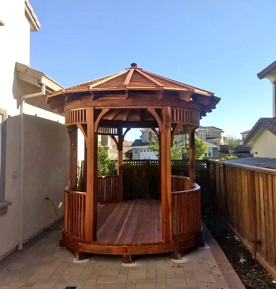 Custom Hexagonal Retreat Pavilion (Options: 15' L x 10'-6" W, Oval Shape Instead of Hexagonal by Custom Request, with Deck, California Redwood, With Upper Corvels and Lower Panels, Transparent Premium Sealant). Photo Courtesy of A. Singh of Dublin, California.
