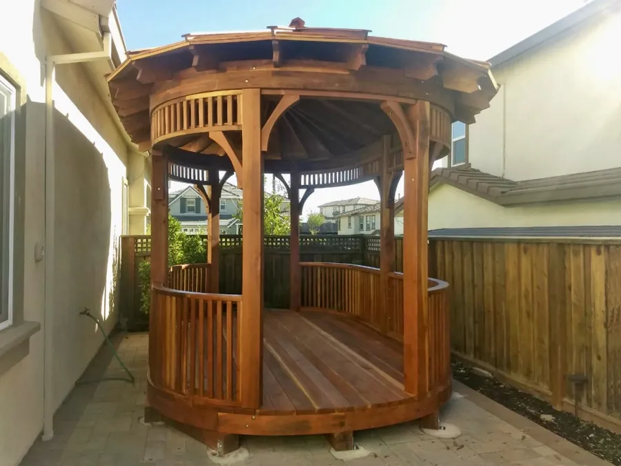 Custom Hexagonal Retreat Pavilion (Options: 15' L x 10'-6" W, Oval Shape Instead of Hexagonal by Custom Request, with Deck, California Redwood, With Upper Corvels and Lower Panels, Transparent Premium Sealant). Photo Courtesy of A. Singh of Dublin, California.