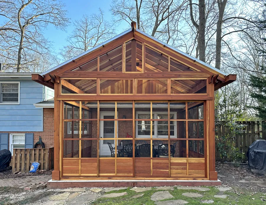 Custom Illuminati Pavilion (Options: 13’-4’’ L x 18’-6’’ W, California Redwood, Enclosed by Custom Request, 11’ Post Height, Standard Post Anchor Kit, 1 Ceiling Fan base, Wooden Cover for Gutter, Transparent Premium Sealant). Photo Courtesy of P. Morris of Seven Corners, VA.