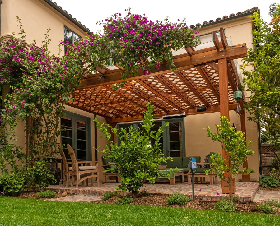 Custom Lattice Pergola Kit (Options: 19' L x 16' W, California Redwood, Electrical Wiring Trim for 2 Posts, 4-Post Kit for Concrete, No Ceiling Fan Base, No Privacy Panels, No Curtain Rods, 9' Post Height, Transparent Premium Sealant). Lattice panels were customized with larger openings than is the standard design. Photo Courtesy of D. Wood of Palo Alto, California.