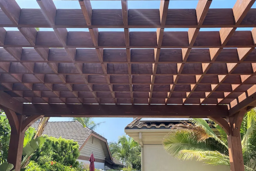 Custom Montvale Pergola (Options: Irregular Shape That is 14' x 16' on 2 Adjacent Sides, But the Side Opposite the 16' was Extended to 22' and Have a 5th Post, California Redwood, 9.5' Posts, Coffee-Stain Premium Sealant). Photo Courtesy of G. Tanaka of Torrance, CA.