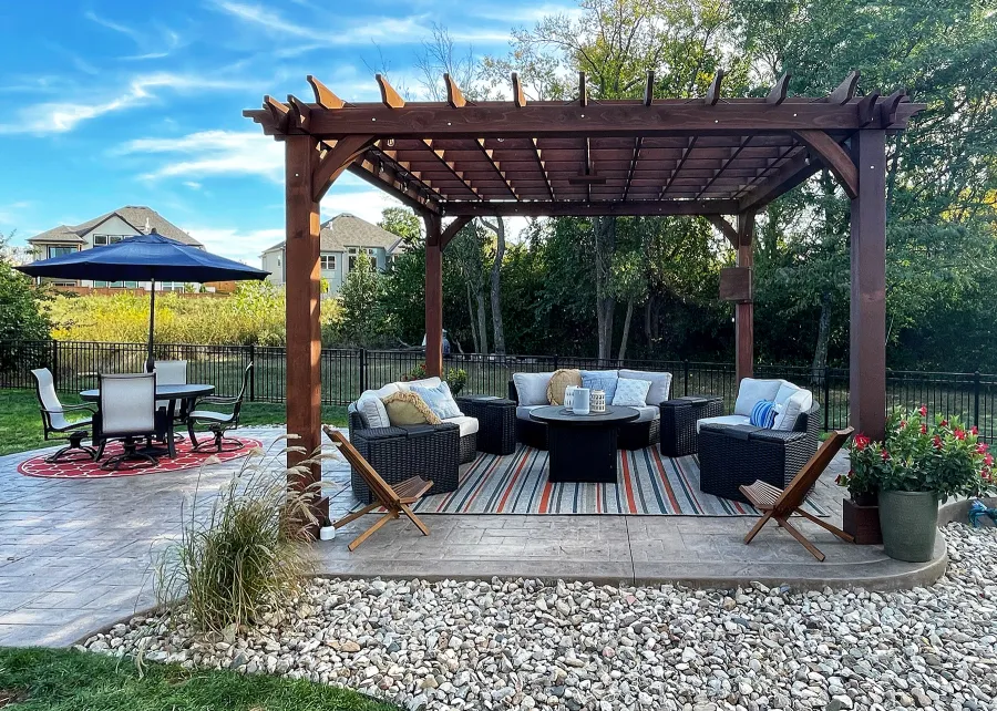 Montvale Pergolas (Options: 16' x 16', Douglas-fir, 10 ft H, 1 Ceiling Fan Base, No Post Decorative Trims, Coffee-Stain Premium Sealant). Photo Courtesy of Billy & Brianne Foster of Olathe, KS.