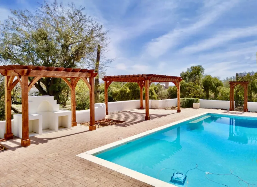 Montvale Pergolas (Options: 14' x 8' & 20' x 16' & 4' x 6', Douglas-fir, Electrical Wiring Trim for 1 Post, Rafters at 16", 4-Post Anchor Kit for High-Wind, No Ceiling Fan Base, No Privacy Panels, 10' Post, Transparent Premium Sealant). Photo courtesy of M. Simpson of Tucson, Arizona.