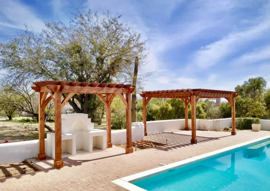 Montvale Pergolas (Options: 14' x 8' & 20' x 16', Douglas-fir, Electrical Wiring Trim for 1 Post, Rafters at 16", 4-Post Anchor Kit for High-Wind, No Ceiling Fan Base, No Privacy Panels, 10' Post, Transparent Premium Sealant). Photo courtesy of M. Simpson of Tucson, Arizona.