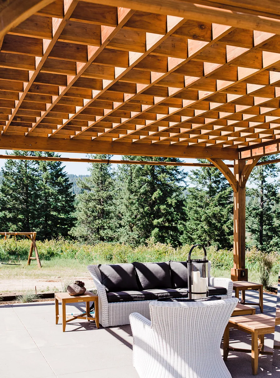 Montvale Pergolas  (Options: 22' x 22', Mature Redwood, 4-Post Anchor Kit for Concrete, Electrical Wiring Trim Kit for 4 Posts, No Ceiling Fan Base, 4 Curtain Rods, No Privacy Panels, 10' Post, Transparent Premium Sealant). Photo Courtesy of J. Scott of Coeur deline, Idaho.