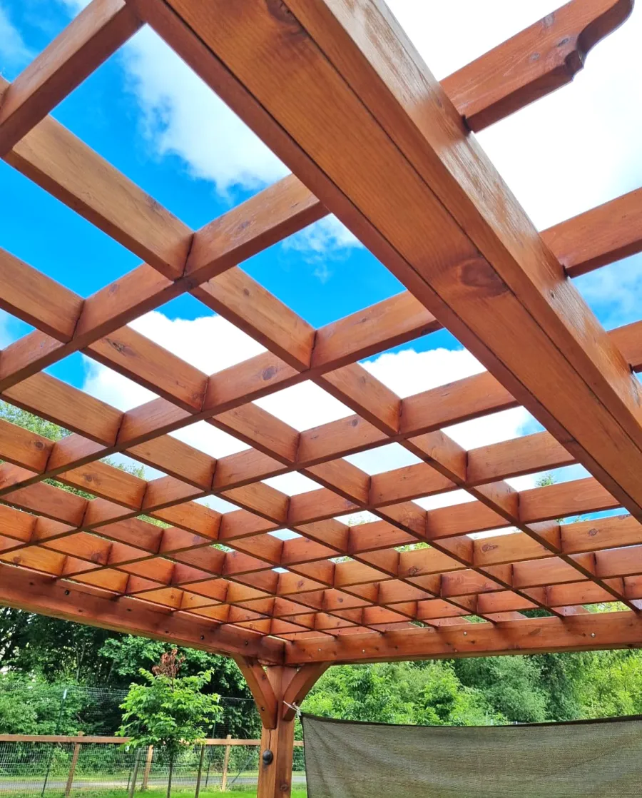 Montvale Pergola (Options: 20' x 14', Mature Redwood, 4-Post Anchor Kit for Concrete, No Ceiling Fan Base, No Curtain Rods, No Privacy Panels, 9' H Posts, Transparent Premium Sealant). Photo Courtesy of R. Greenfield of Gig Harbor, Washington.