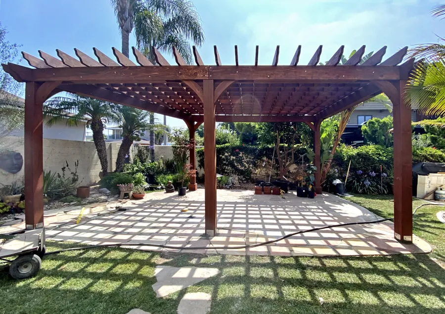 Custom Montvale Pergola (Options: Irregular Shape That is 14' x 16' on 2 Adjacent Sides, But the Side Opposite the 16' was Extended to 22' and Have a 5th Post, California Redwood, 9.5' Posts, Coffee-Stain Premium Sealant). Photo Courtesy of G. Tanaka of Torrance, CA.