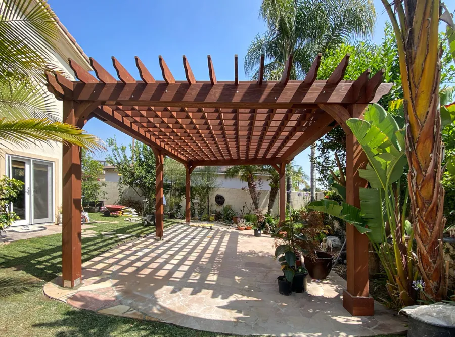 Custom Montvale Pergola (Options: Irregular Shape That is 14' x 16' on 2 Adjacent Sides, But the Side Opposite the 16' was Extended to 22' and Have a 5th Post, California Redwood, 9.5' Posts, Coffee-Stain Premium Sealant). Photo Courtesy of G. Tanaka of Torrance, CA.