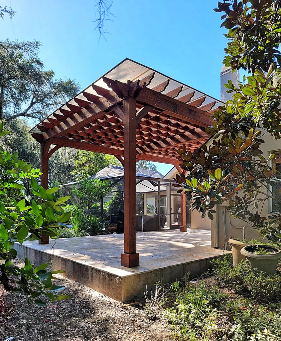 Custom Attached Montvale Pergola (Options: 26' x 18', California Redwood, 12' Posts, with Rain Guard, Coffee-Stain Premium Sealant). Photo Courtesy of D. Fournier of Valrico, FL.