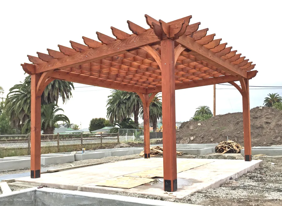 Montvale Pergolas (Options: 16' x 20', Mature Redwood, 4-Post Anchor Kit for Concrete, No Ceiling Fan Base, No Curtain Rods, No Privacy Panels, 9.5' Post, Transparent Premium Sealant). Photos taken in Carpinteria Garden Park during construction, May 10, 2017. Photo Courtesy of Carpinteria Park, 5775 Carpinteria Avenue  Carpinteria, CA  93013.