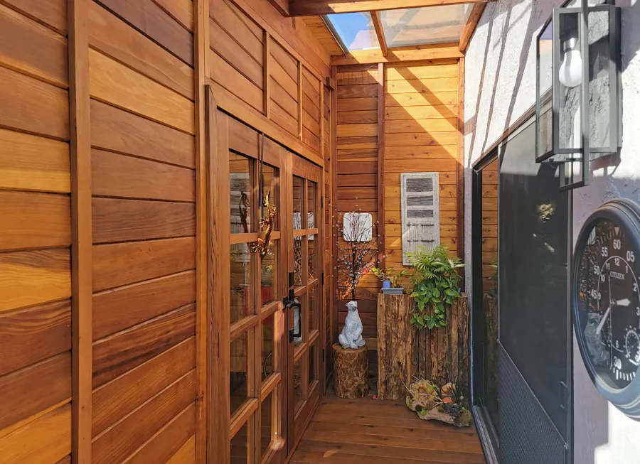 Palo Alto Backyard Cabin (Options: 18' L, 16' W, Without Porch, Structural Deck - Interior and 4' Exterior, California Redwood, Sugar Pine Internal Walls and Ceiling, Windows Purchased Locally, With Two 3' x 5' Skylights, Metal Roof, Custom Railings and Steps, Electrical Wire Trim on the Walls, Transparent Premium Sealant). Photo Courtesy of A. Ramon of South San Francisco, California.