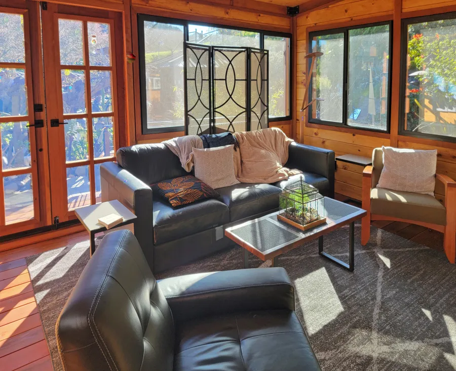 Palo Alto Backyard Cabin (Options: 18' L, 16' W, Without Porch, Structural Deck - Interior and 4' Exterior, California Redwood, Sugar Pine Internal Walls and Ceiling, Windows Purchased Locally, With Two 3' x 5' Skylights, Metal Roof, Custom Railings and Steps, Electrical Wire Trim on the Walls, Transparent Premium Sealant). Photo Courtesy of A. Ramon of South San Francisco, California.