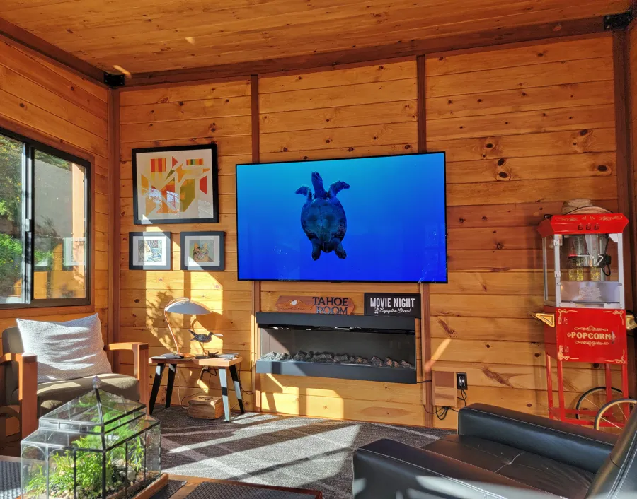 Palo Alto Backyard Cabin (Options: 18' L, 16' W, Without Porch, Structural Deck - Interior and 4' Exterior, California Redwood, Sugar Pine Internal Walls and Ceiling, Windows Purchased Locally, With Two 3' x 5' Skylights, Metal Roof, Custom Railings and Steps, Electrical Wire Trim on the Walls, Transparent Premium Sealant). Photo Courtesy of A. Ramon of South San Francisco, California.