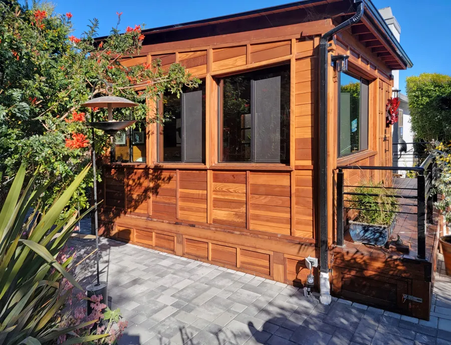 Palo Alto Backyard Cabin (Options: 18' L, 16' W, Without Porch, Structural Deck - Interior and 4' Exterior, California Redwood, Sugar Pine Internal Walls and Ceiling, Windows Purchased Locally, With Two 3' x 5' Skylights, Metal Roof, Custom Railings and Steps, Electrical Wire Trim on the Walls, Transparent Premium Sealant). Photo Courtesy of A. Ramon of South San Francisco, California.