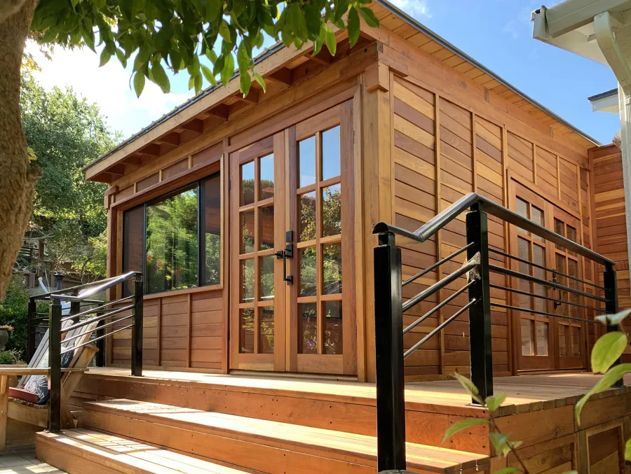 Palo Alto Backyard Cabin (Options: 18' L, 16' W, Without Porch, Structural Deck - Interior and 4' Exterior, California Redwood, Sugar Pine Internal Walls and Ceiling, Windows Purchased Locally, With Two 3' x 5' Skylights, Metal Roof, Custom Railings and Steps, Electrical Wire Trim on the Walls, Transparent Premium Sealant). Photo Courtesy of A. Ramon of South San Francisco, California.