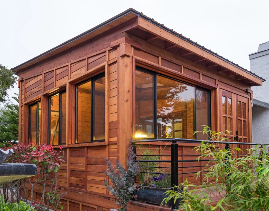 Palo Alto Backyard Cabin (Options: 18' L, 16' W, Without Porch, Structural Deck - Interior and 4' Exterior, California Redwood, Sugar Pine Internal Walls and Ceiling, Windows Purchased Locally, With Two 3' x 5' Skylights, Metal Roof, Custom Railings and Steps, Electrical Wire Trim on the Walls, Transparent Premium Sealant). Photo Courtesy of A. Ramon of South San Francisco, California.