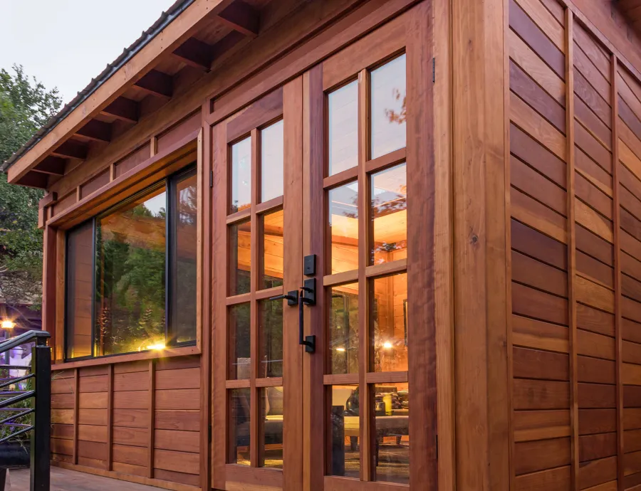 Palo Alto Backyard Cabin (Options: 18' L, 16' W, Without Porch, Structural Deck - Interior and 4' Exterior, California Redwood, Sugar Pine Internal Walls and Ceiling, Windows Purchased Locally, With Two 3' x 5' Skylights, Metal Roof, Custom Railings and Steps, Electrical Wire Trim on the Walls, Transparent Premium Sealant). Photo Courtesy of A. Ramon of South San Francisco, California.