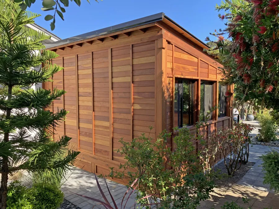 Palo Alto Backyard Cabin (Options: 18' L, 16' W, Without Porch, Structural Deck - Interior and 4' Exterior, California Redwood, Sugar Pine Internal Walls and Ceiling, Windows Purchased Locally, With Two 3' x 5' Skylights, Metal Roof, Custom Railings and Steps, Electrical Wire Trim on the Walls, Transparent Premium Sealant). Photo Courtesy of A. Ramon of South San Francisco, California.