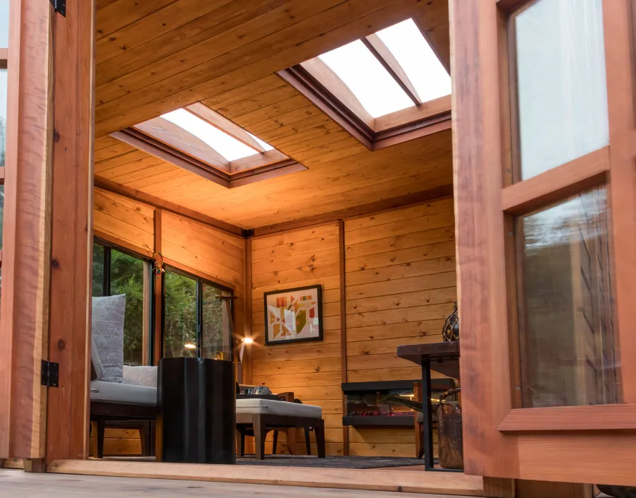 Palo Alto Backyard Cabin (Options: 18' L, 16' W, Without Porch, Structural Deck - Interior and 4' Exterior, California Redwood, Sugar Pine Internal Walls and Ceiling, Windows Purchased Locally, With Two 3' x 5' Skylights, Metal Roof, Custom Railings and Steps, Electrical Wire Trim on the Walls, Transparent Premium Sealant). Photo Courtesy of A. Ramon of South San Francisco, California.