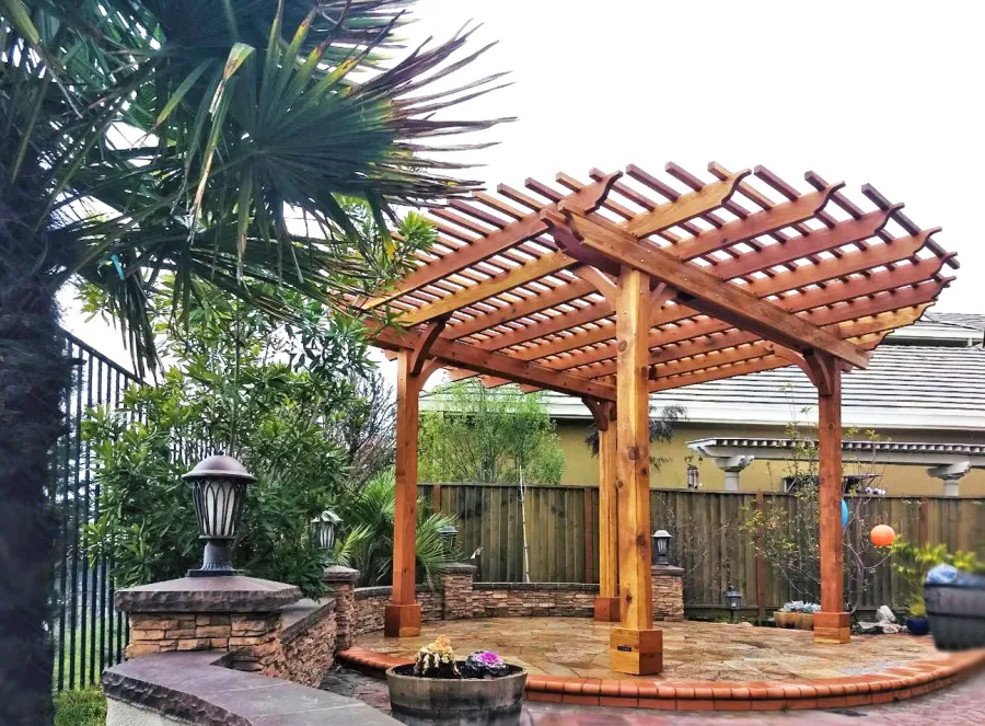 Round Pergola (Options: 16' Diameter, No Privacy Panel, California Redwood, Open Roof Slats at 6", 9.5ft Post Height, Include Electrical Wiring Trim for 2 Posts, 4-Post Anchor Kit for Stone, No Post Decorative Trim, No Ceiling Fan Base, No Curtain Rods, Transparent Premium Sealant). Photo courtesy of Harish B. of Dublin, CA