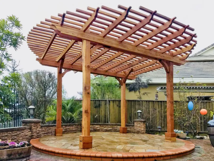 Round Pergola (Options: 16' Diameter, No Privacy Panel, California Redwood, Open Roof Slats at 6", 9.5ft Post Height, Include Electrical Wiring Trim for 2 Posts, 4-Post Anchor Kit for Stone, No Post Decorative Trim, No Ceiling Fan Base, No Curtain Rods, Transparent Premium Sealant). Photo courtesy of Harish B. of Dublin, CA