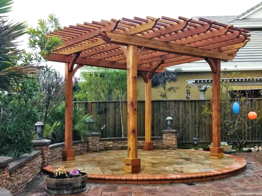 Round Pergola (Options: 16' Diameter, No Privacy Panel, California Redwood, Open Roof Slats at 6", 9.5ft Post Height, Include Electrical Wiring Trim for 2 Posts, 4-Post Anchor Kit for Stone, No Post Decorative Trim, No Ceiling Fan Base, No Curtain Rods, Transparent Premium Sealant). Photo courtesy of Harish B. of Dublin, CA