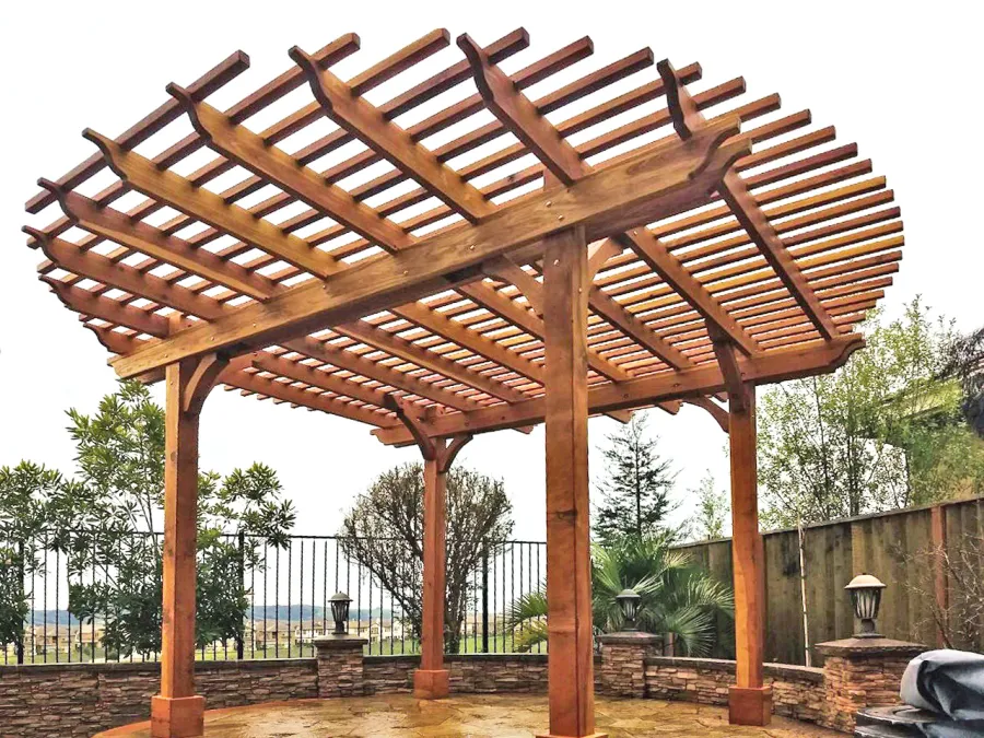 Round Pergola (Options: 16' Diameter, No Privacy Panel, California Redwood, Open Roof Slats at 6", 9.5ft Post Height, Include Electrical Wiring Trim for 2 Posts, 4-Post Anchor Kit for Stone, No Post Decorative Trim, No Ceiling Fan Base, No Curtain Rods, Transparent Premium Sealant). Photo courtesy of Harish B. of Dublin, CA