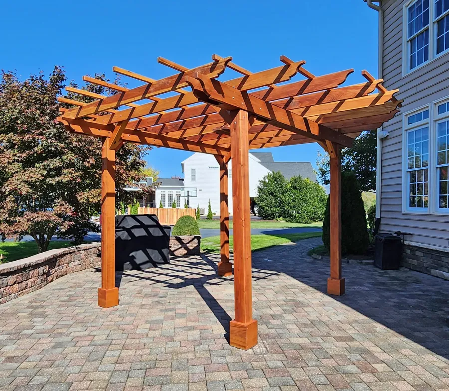 Round Pergola (Options: 16' Diameter, No Privacy Panel, California Redwood, Open Roof Slats at 18", 9ft Post Height, Include Electrical Wiring Trim for 2 Posts, 4-Post Anchor Kit for Concrete, No Post Decorative Trim, 1 Ceiling Fan Base, No Curtain Rods, Transparent Premium Sealant). Photo courtesy of J. Holobinko of Hagerstown, MD.