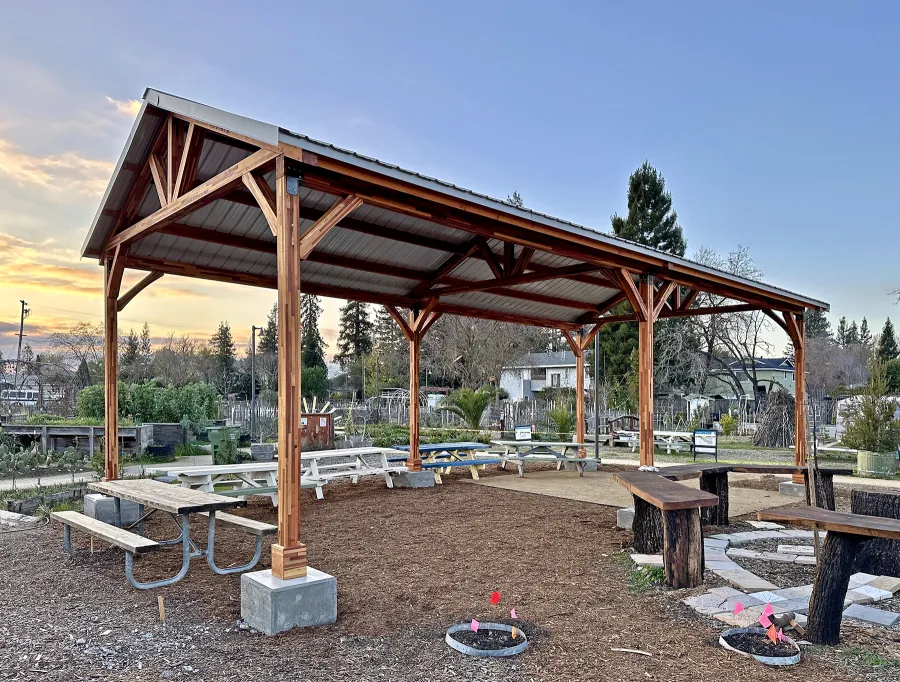 San Carlos Carport Pavilion (Options: 40' L x 20' W, Mosaic Redwood, 6- Post Stainless Steel High Wind Anchor Kit, 10' H Posts, 6x6 Posts, Electrical Wiring Trim Kit for 1 Post, Transparent Premium Sealant). Order installed at Bayer Park Gardens, 1550 West Ave. Santa Rosa, CA.