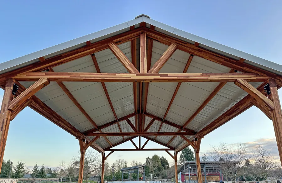 San Carlos Carport Pavilion (Options: 40' L x 20' W, Mosaic Redwood, 6- Post Stainless Steel High Wind Anchor Kit, 10' H Posts, 6x6 Posts, Electrical Wiring Trim Kit for 1 Post, Transparent Premium Sealant). Order installed at Bayer Park Gardens, 1550 West Ave. Santa Rosa, CA.