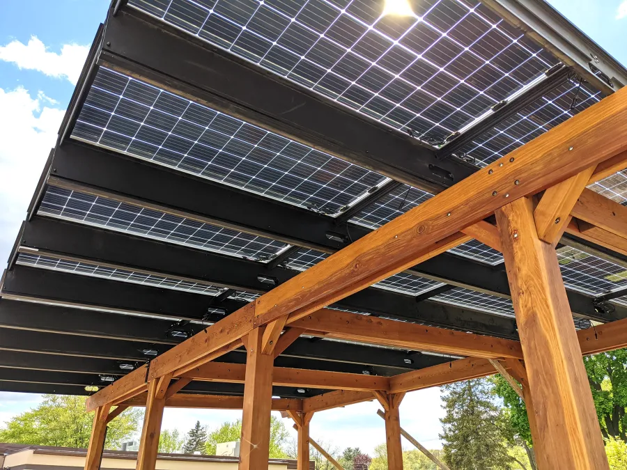 Solar Pergola (Options: 33' x 14', California Redwood, 8-Post Anchor Kit for High-Wind, Transparent Premium Sealant). Solar Panels Installed by Customer. Photo Courtesy of C. Couillard of Deerfield, Wisconsin.