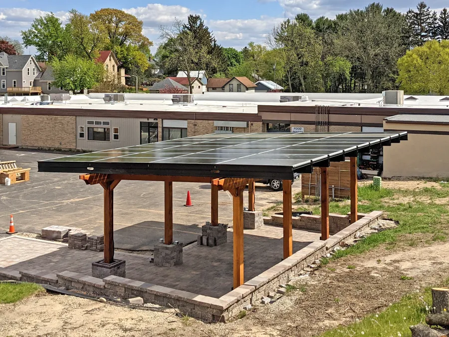 Solar Pergola (Options: 33' x 14', California Redwood, 8-Post Anchor Kit for High-Wind, Transparent Premium Sealant). Solar Panels Installed by Customer. Photo Courtesy of C. Couillard of Deerfield, Wisconsin.