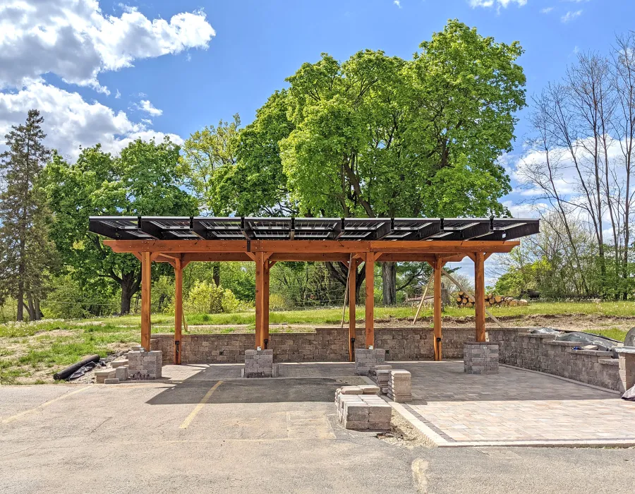 Solar Pergola (Options: 33' x 14', California Redwood, 8-Post Anchor Kit for High-Wind, Transparent Premium Sealant). Solar Panels Installed by Customer. Photo Courtesy of C. Couillard of Deerfield, Wisconsin.