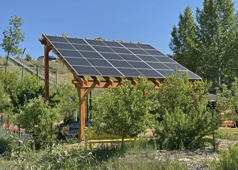 Solar Pergola (Options: 23' L x 18' W, Mosaic California Redwood, 12:7 Pitch, Post Anchor Kit for High-Wind, Transparent Premium Sealant). Pergola Installed in Colorado Mountain College in Steamboat Springs, CO.
