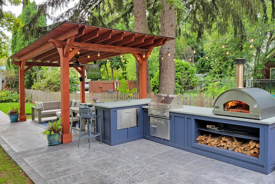 Sunset Patio Pavilion (Options: 22' x 12', No Privacy Panel, Douglas-fir, 10ft H, No Electrical Wiring Trim, 4-Post Anchor Kit for Concrete, No Post Decorative Trim, No Ceiling Fan Base, No Curtain Rods, Cherry Stain Premium Sealant). Photo Courtesy of J. Osborne of Saratoga Springs, NY.