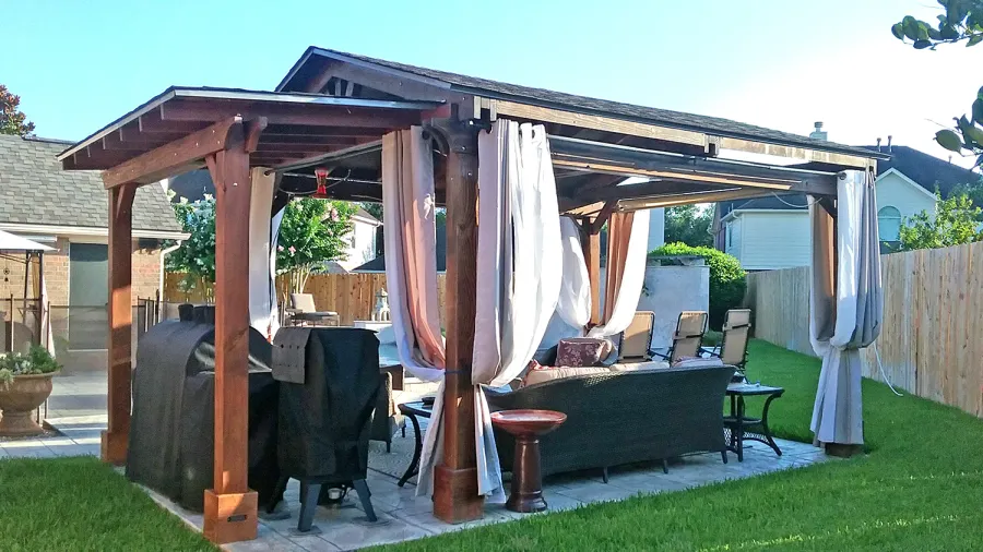 Sunset Patio Pavilion Attached to a Del Norte Pavilion (Options: 10' x 5', Douglas-fir, No Ceiling Fan Base, No Electrical Wiring Trim Kit, 2-Post Anchor Kit for Concrete, Transparent Premium Sealant). Photo Courtesy of Jennifer Grizzle of Katy, Texas.
