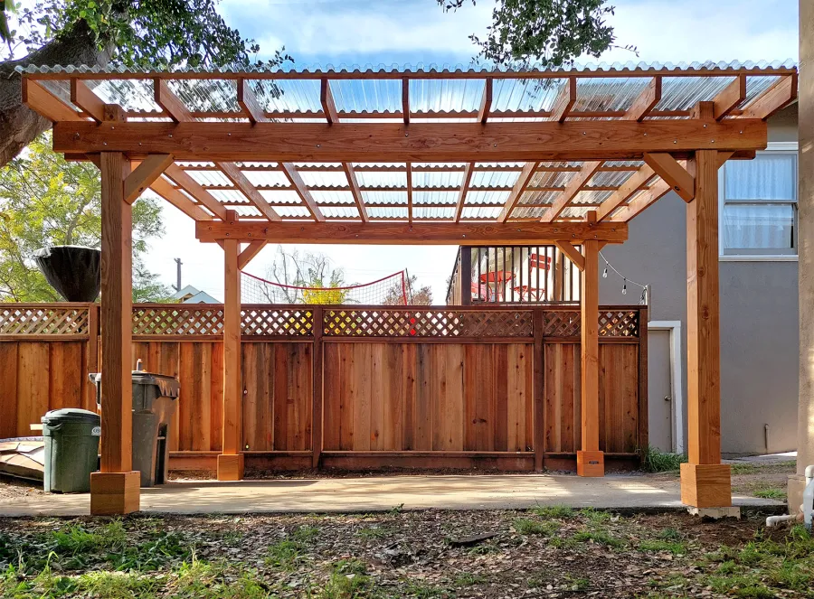 Custom Sunset Patio Pavilion (Options: 15' L x 10'-6" W, No Privacy Panels, Douglas-fir, No Electrical Wiring Trim, 4-Post Anchor Kit for Concrete, No Post Decorative Trim, with Transparent Polycarbonate Roofing Panels Instead of the Standard Roof Boards, No Ceiling Fan Base, No Curtain Rods, Transparent Premium Sealant). Photo Courtesy of L. Draper of Aptos, California.