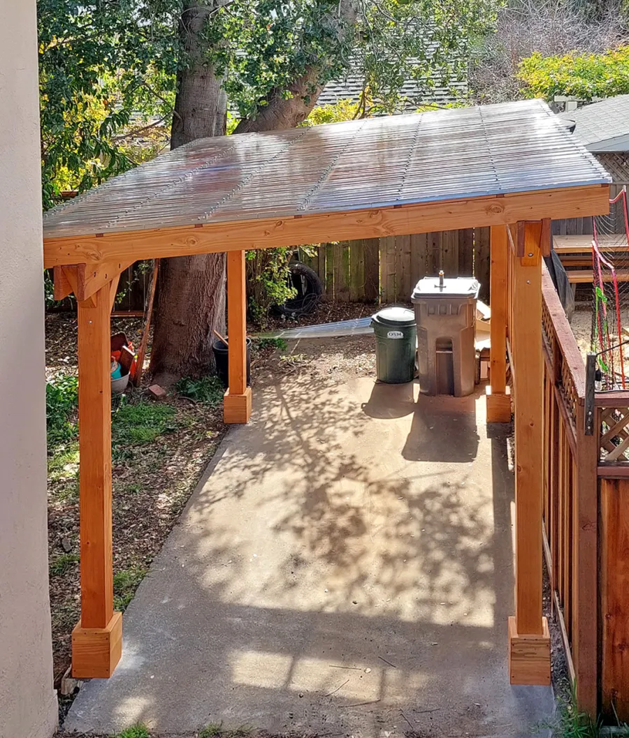 Custom Sunset Patio Pavilion (Options: 15' L x 10'-6" W, No Privacy Panels, Douglas-fir, No Electrical Wiring Trim, 4-Post Anchor Kit for Concrete, No Post Decorative Trim, with Transparent Polycarbonate Roofing Panels Instead of the Standard Roof Boards, No Ceiling Fan Base, No Curtain Rods, Transparent Premium Sealant). Photo Courtesy of L. Draper of Aptos, California.