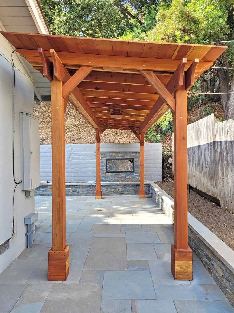 Sunset Patio Pavilion (Options: 8' x 24', No Privacy Panel, California Redwood, 9ft H, No Electrical Wiring Trim, 4-Post Anchor Kit for High-Wind, No Post Decorative Trim, 1 Ceiling Fan Base, No Curtain Rods, Transparent Premium Sealant). Photo Courtesy of M. Horn of Redwood City, CA.