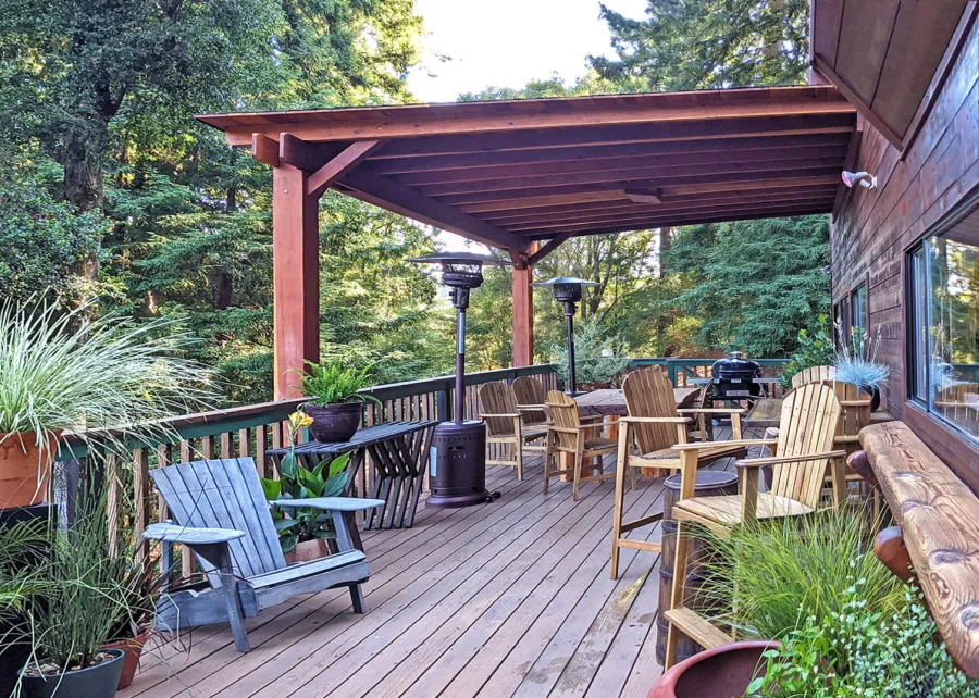 Sunset Porch Pavilion (Options: 18' L x 15' W, California Redwood, Attached to House, 22ft H Posts [From Ground to Tall Deck] by Custom Request, No Electrical Wiring Trim, 2-Post Anchor Kit for Concrete, No Post Decorative Trim, No Ceiling Fan Base, No Curtain Rods, Transparent Premium Sealant). Photo Courtesy of L. Draper of Aptos, California.