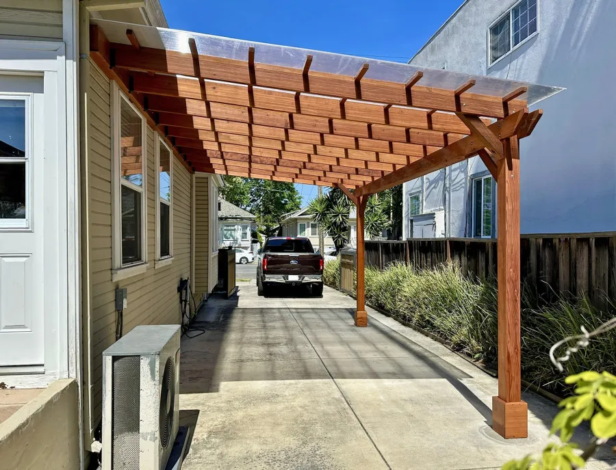 Custom Sunset Porch Pavilion (Options: 20' L x 12' W, Mature Redwood, No Electrical Wiring Trim, 2-Post Anchor Kit for Concrete, 10' H Posts, No Post Decorative Trim, with Transparent Polycarbonate Roofing Panels Instead of the Standard Roof Boards, No Ceiling Fan Base, No Curtain Rods, Transparent Premium Sealant). Photo Courtesy of M. Bualat of San Jose, CA.