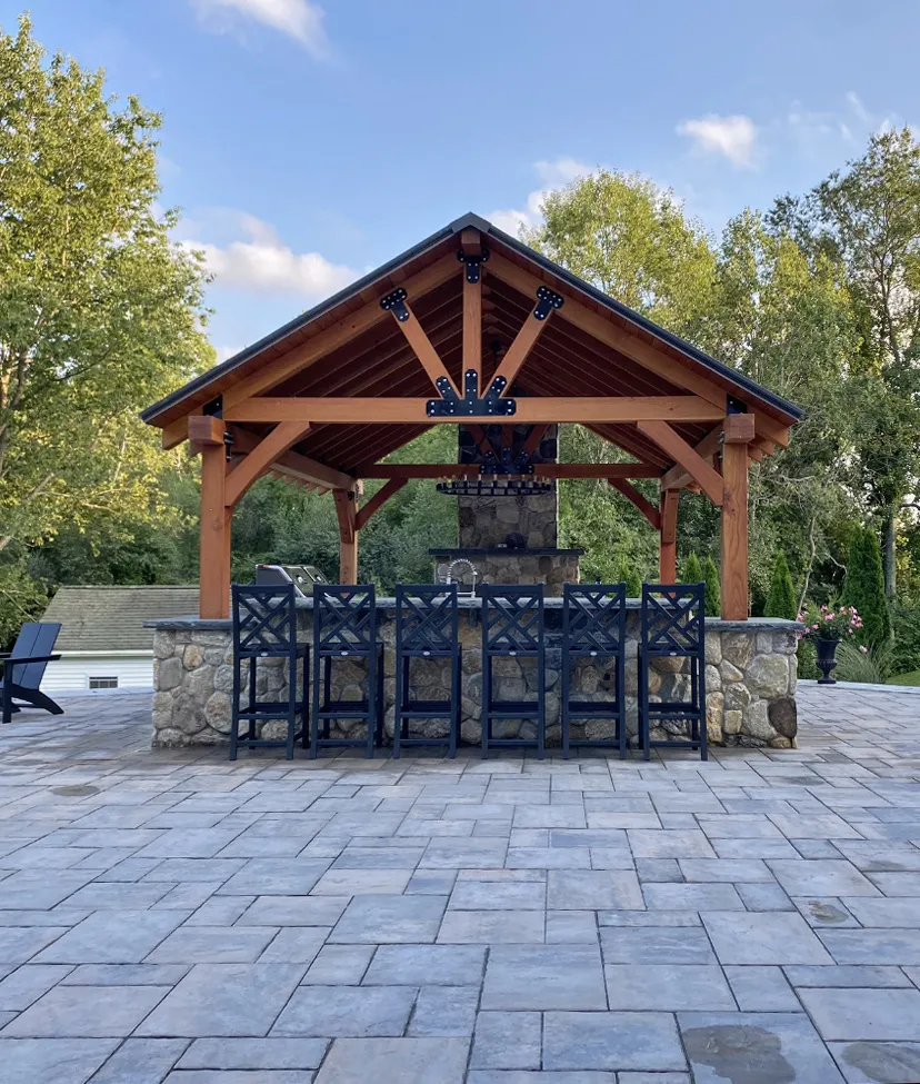 Thick Timber Toledo Wood Pavilion (Options: 20' L x 16' W, Douglas-fir, 8' H Posts, 4-Post Anchor Kit for High-Wind, Transparent Premium Sealant). Photo Courtesy of J & B Laperle of Auburn, MA.