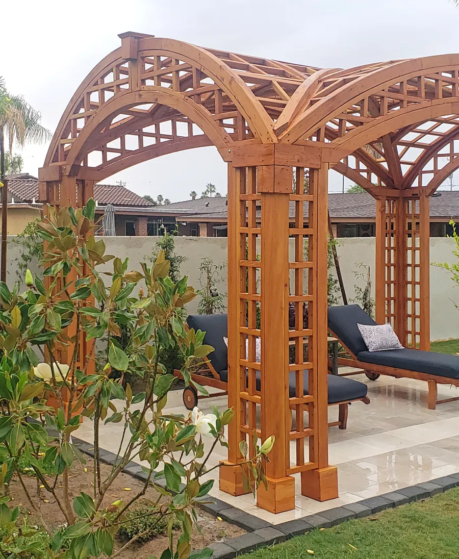 Victorian Arch Trellis Pergola (Options: 16' L x 10' W, Douglas-fir, Post Anchor Kit for Concrete, No Rain Guard, Transparent Premium Sealant). Photo Courtesy of B. Rowlison of Martinez Lake, AZ.