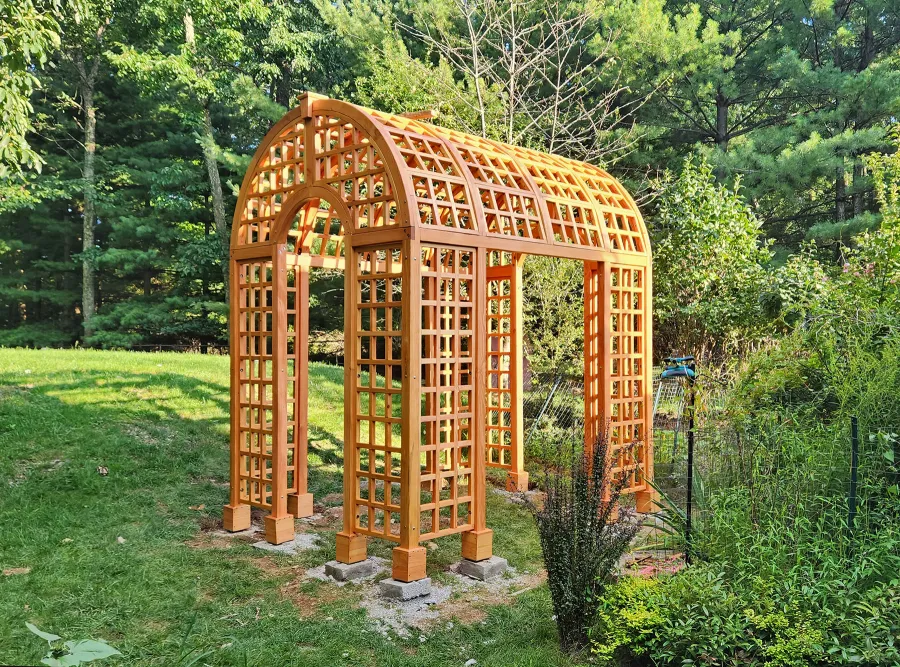 The Victorian Trellis (Options: 10' L x 8' W, Without Arcs and Lattice Panels, Douglas-fir, No Rain Guard, No Electrical Wiring Trim, Post Anchor Kit for High-Wind, 4x4 Posts, No Ceiling Fan Base, Transparent Premium Sealant). Photo Courtesy of C. Freeman of Saylorsburg, PA.