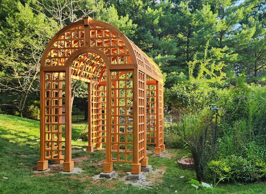 The Victorian Trellis (Options: 10' L x 8' W, Without Arcs and Lattice Panels, Douglas-fir, No Rain Guard, No Electrical Wiring Trim, Post Anchor Kit for High-Wind, 4x4 Posts, No Ceiling Fan Base, Transparent Premium Sealant). Photo Courtesy of C. Freeman of Saylorsburg, PA.