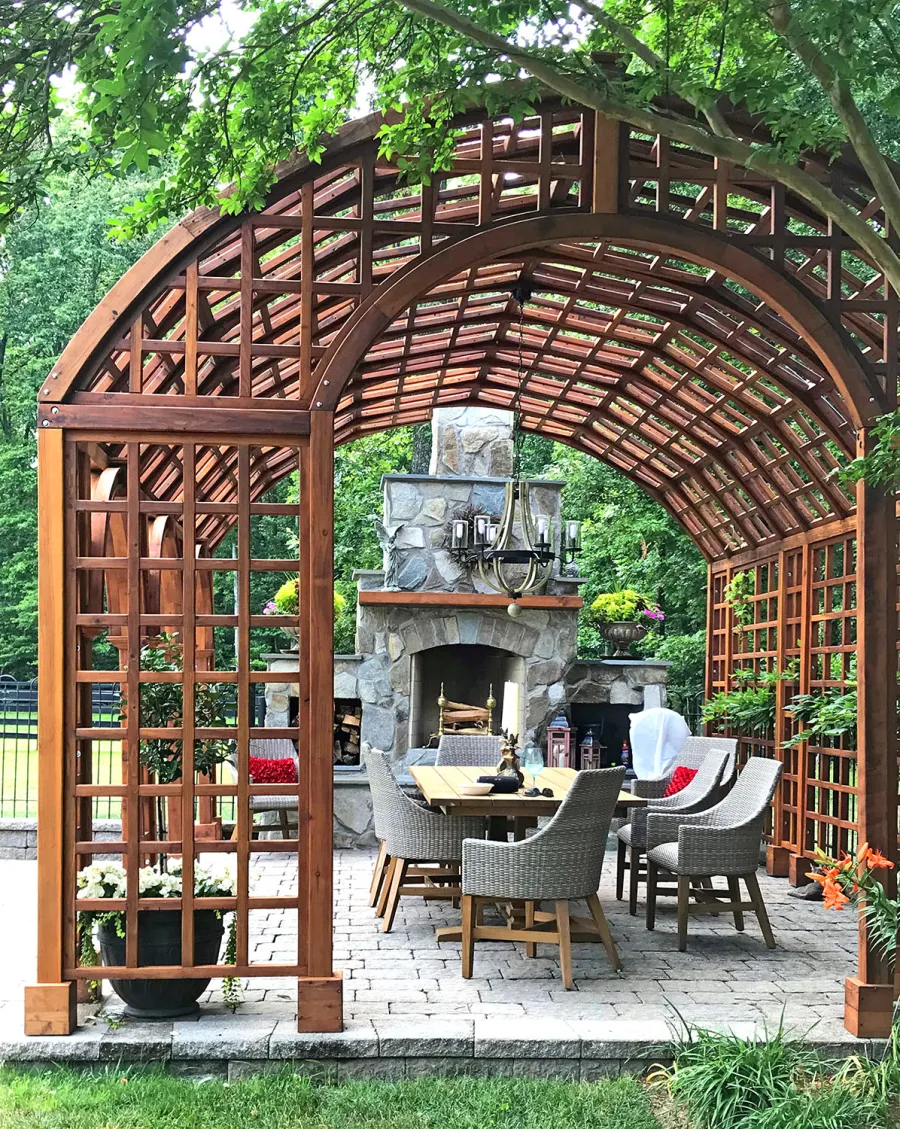 The Victorian Trellis (Options: 22' L x 14' W, Combination of Arcs and Lattice Panels, Mature Redwood, No Rain Guard, 9' Post Height, No Electrical Wiring Trim, Post Anchor Kit for Stone, No Ceiling Fan Base, Transparent Premium Sealant). Photo Courtesy of JR and Trish West of King George, Virginia.