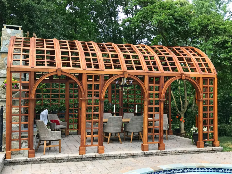 The Victorian Trellis (Options: 22' L x 14' W, Combination of Arcs and Lattice Panels, Mature Redwood, No Rain Guard, 9' Post Height, No Electrical Wiring Trim, Post Anchor Kit for Stone, No Ceiling Fan Base, Transparent Premium Sealant). Photo Courtesy of JR and Trish West of King George, Virginia.